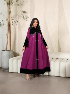 Elegant purple velvet abaya with black patchwork, sequins, and rhinestone decorative details