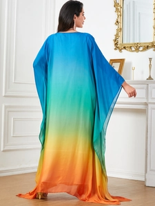 Elegant gradient kaftan dress in blue, green and orange with batwing sleeves and long silhouette