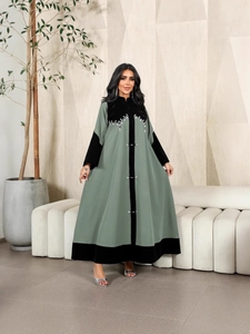 Green and black velvet patchwork Abaya robe with silver beaded geometric patterns