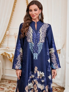 Detail view of ethnic navy blue maxi dress with intricate pearl embroidery and satin texture