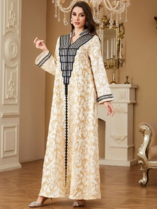Elegant V-neck long sleeve kaftan dress with golden embroidery and ethnic patterns