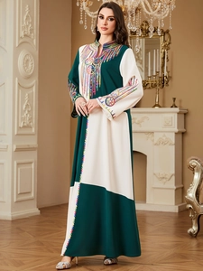 Detail of embroidered neckline and contrast paneling on this elegant loose kaftan dress