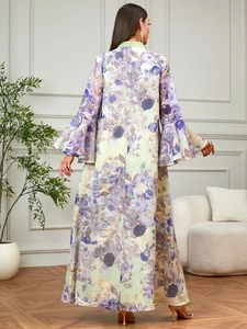 Floral print V-neck Abaya dress with bell sleeves and purple floral patterns on light green