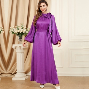 Detailed view of elegant purple satin dress with gathered high collar and silky texture