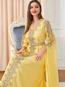 Detailed golden embroidery and sequin craft on pale yellow chiffon Kaftan dress