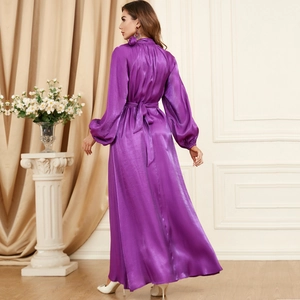 Rear view of purple satin long sleeve dress showing elegant waist tie and lantern sleeves