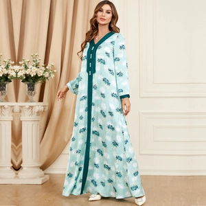 Elegant mint green long sleeve V-neck maxi dress with tropical leaf print and pearl buttons