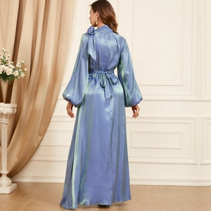 Elegant long-sleeved dress in iridescent blue-purple fabric with back neck tie and waist belt