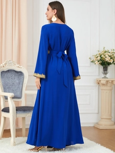 Detail of royal blue abaya featuring gold embroidery on sleeves and cinched waistline