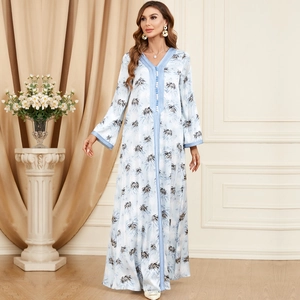 Elegant light blue long sleeve V-neck maxi dress with tropical palm leaf print
