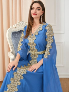 Detailed golden embroidery on dark blue long sleeve kaftan dress with woven belt