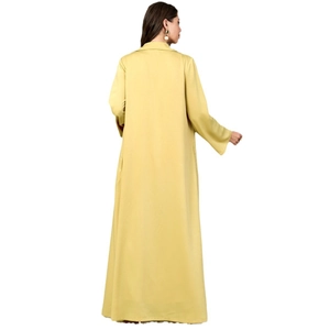 Back view of a long mustard yellow lapel coat with long sleeves and straight silhouette
