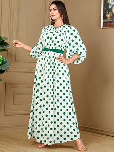 Elegant white maxi dress with green polka dots, lantern sleeves and a waist belt