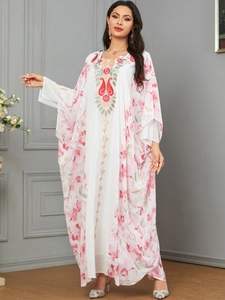 Elegant white kaftan dress featuring batwing sleeves and floral embroidery details