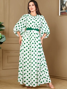 Polka dot long dress with lantern sleeves and green waist belt on white background