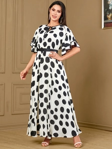 Chic white polka dot maxi dress with tiered ruffle sleeves and elegant waist tie