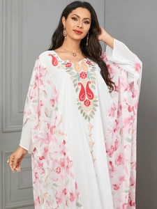 Elegant white kaftan dress with floral prints and ethnic embroidery in batwing style