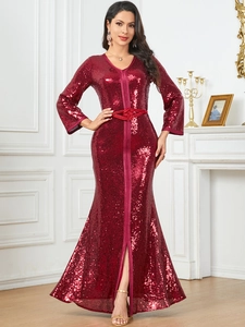 Close-up of wine red sequin kaftan dress with V-neck, waist tie, and elegant front slit