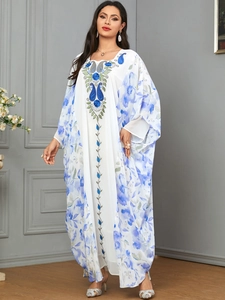 Elegant white kaftan dress with blue floral print and paisley embroidery detail