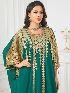 Detail view of emerald green Kaftan with gold diamond sequin embroidery and jewelry