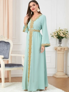 Mint green Moroccan kaftan dress featuring gold lace embroidery and flared sleeves