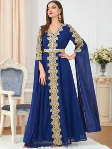 Detail of navy blue kaftan with gold lace embroidery and long split cape sleeves