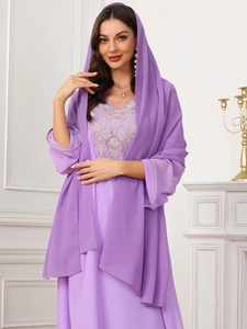 Detail of lavender chiffon abaya with elegant floral embroidery and matching hijab
