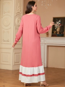 Elegant pink long sleeve maxi dress with tiered white ruffle hem and side pockets