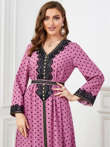 Elegant bohemian pink polka dot maxi dress with black lace V-neck and gold buttons