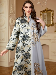 Detail of jacquard gown with sequin floral embroidery and contrasting patchwork design