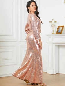 Detail of rose gold sequin evening gown showing side slit and shimmering metallic texture