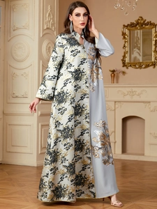 Detail of luxury jacquard abaya showing floral embroidery and sequin patchwork texture
