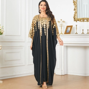 Elegant black Middle Eastern gown with ornate gold embroidery and sequined sleeves