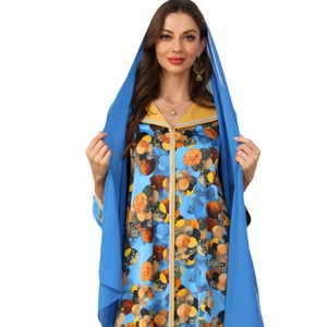 Middle Eastern style blue polka dot dress with matching chiffon headscarf and V-neckline