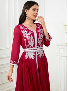 Detail of silver leaf embroidery on burgundy long-sleeved elegant chiffon maxi dress
