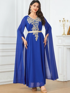 Detail of navy blue robe dress with gold embroidery and elegant cape split sleeves