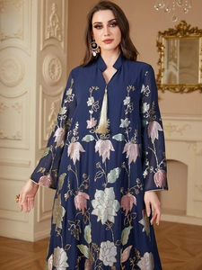 Detailed embroidery and sequins on navy blue chiffon dress with gold tassel accent