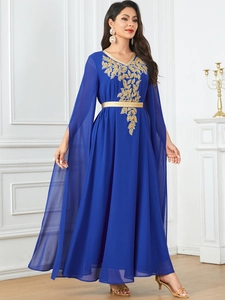 Detail of navy blue abaya with gold leaf embroidery and elegant cape style sleeves