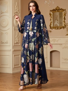 Detailed embroidery on luxury navy kaftan with gold tassels and floral sequin accents