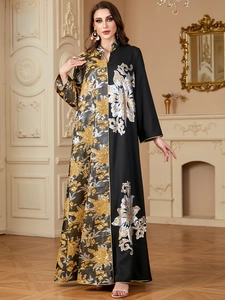 Detail view of jacquard kaftan dress with gold floral embroidery and split V-neckline