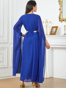 Detail of royal blue maxi dress featuring split sheer cape sleeves and gold belt accent