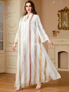 Detail of white chiffon maxi dress featuring vibrant multi-color sequin vertical stripes
