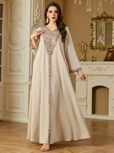 Elegant beige ethnic kaftan with colorful floral embroidery and long sleeves for women