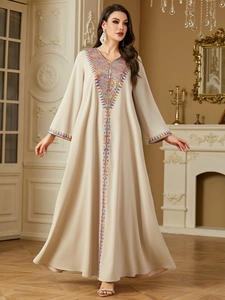 Elegant beige ethnic kaftan dress with colorful embroidery and long sleeves for women