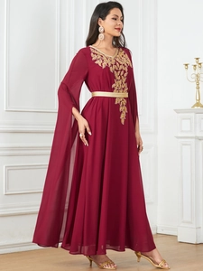 Detail of burgundy chiffon kaftan with golden leaf embroidery and flowing split sleeves