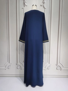Detailed back view of navy blue Abaya featuring gold embroidered cuffs and fluid drape