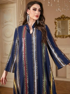 Detail of navy chiffon maxi dress with gold sequin embroidery and colorful vertical stripes