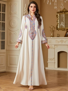 Exquisite embroidery detail on neckline and sleeves of cream bohemian kaftan dress