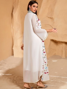 Elegant white chiffon kaftan dress with colorful floral embroidery and flared long sleeves