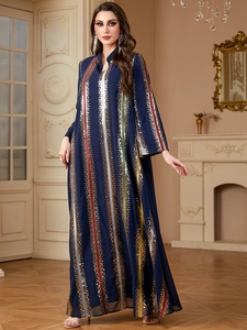 Detail of dark blue chiffon abaya with vertical multi-color sequin stripes and embroidery